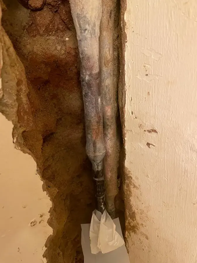 Corroded supply pipe inside an opened wall cavity after a pipe leak, Loveland, CO
