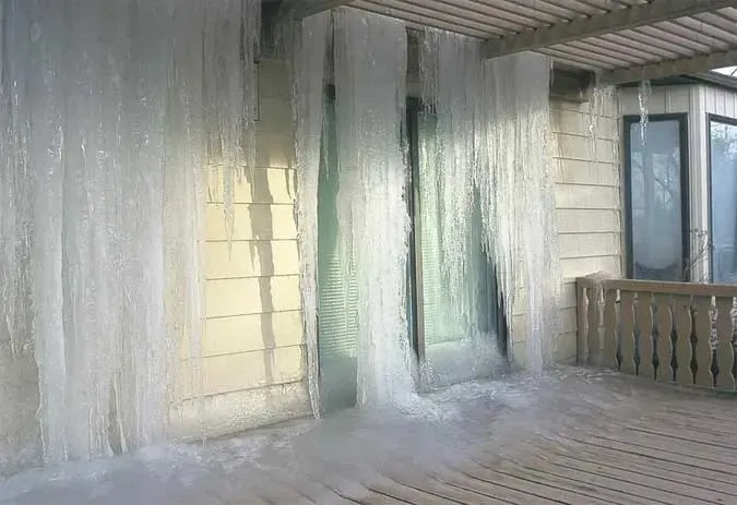 Ice coating a porch and wall after a frozen line burst in a hard freeze, Loveland, CO